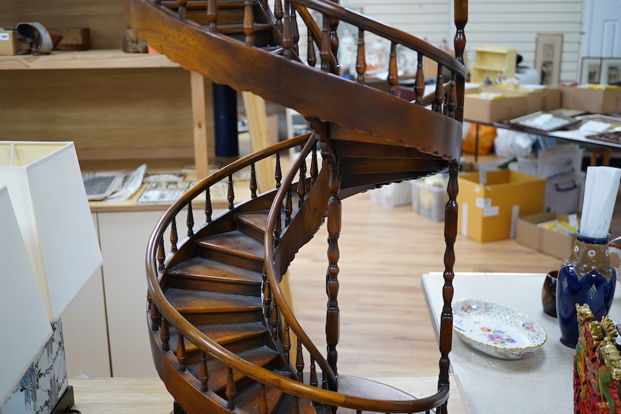 A scale model hardwood spiral staircase, 106cm tall. Condition - good